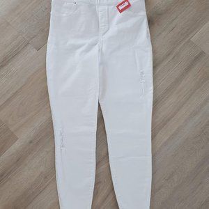 New w/tags. White Spanx Distressed Skinny Jeans